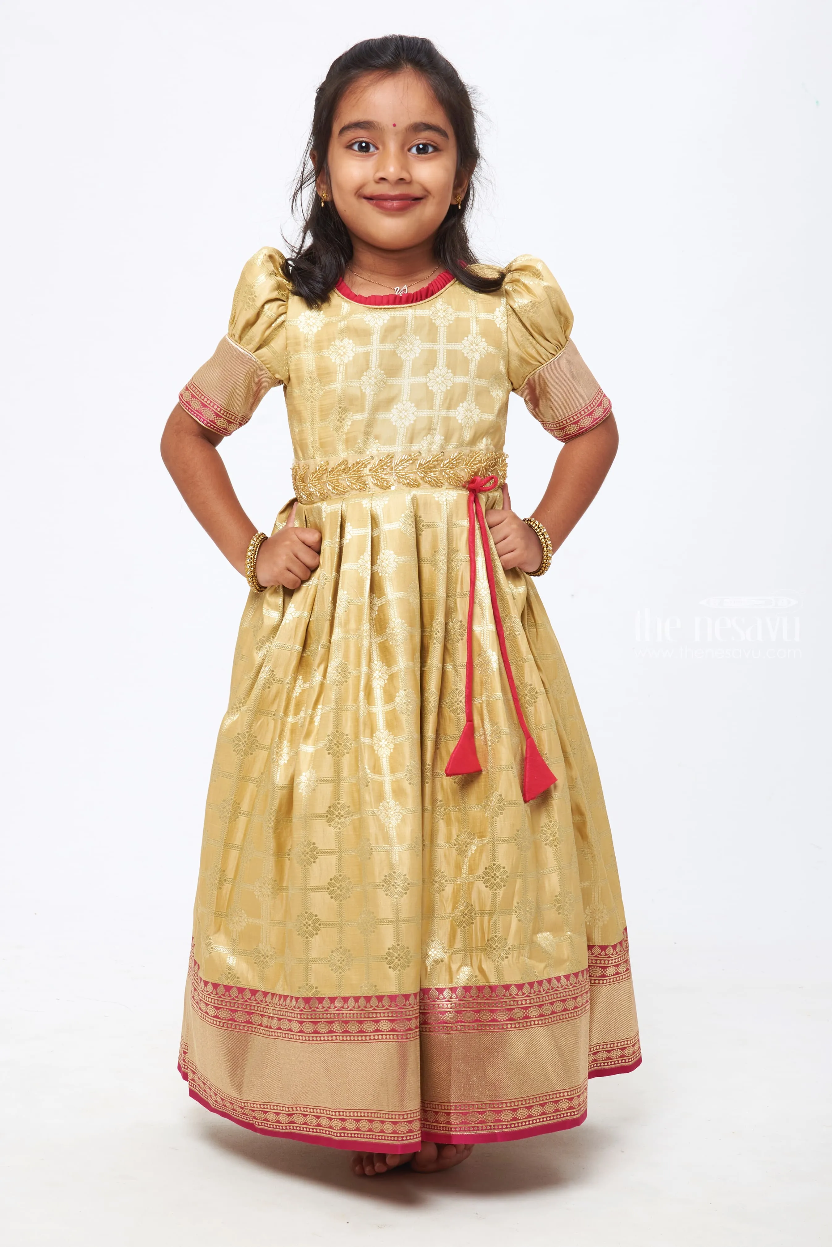 Beige Beauty: Zari Checkered Floral Pleated Gown with Pink Accents for Girls